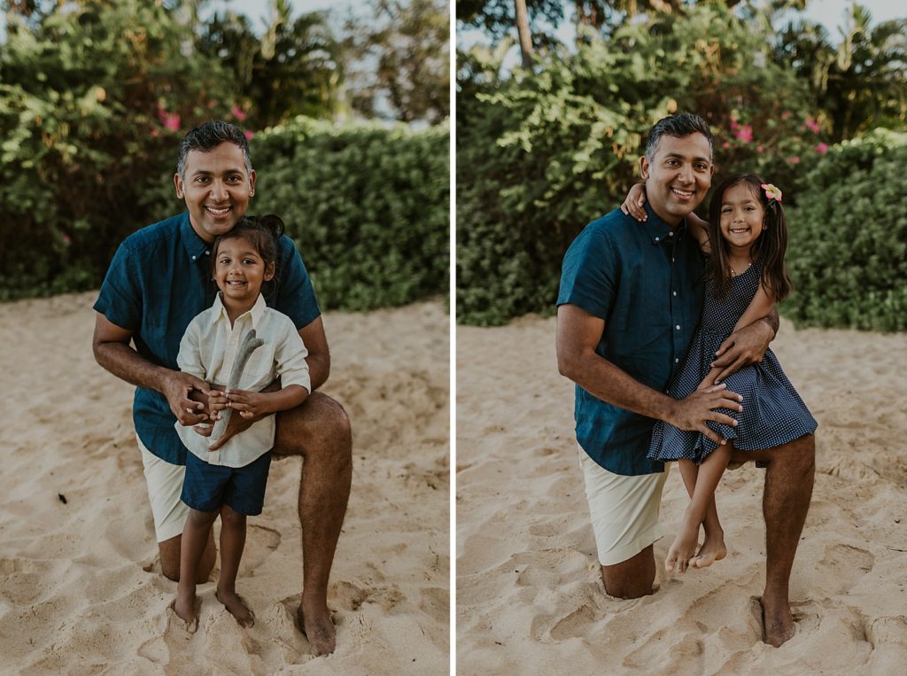 Father holding children portraits on sand