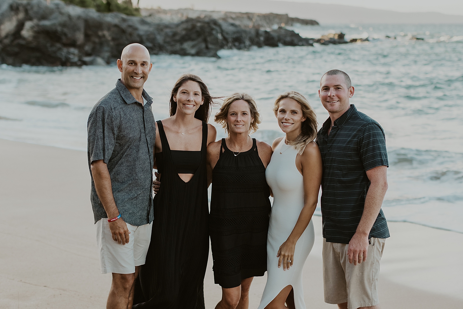 Portrait of family with extended family by the ocean shoreline